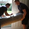 Movers moving a rug